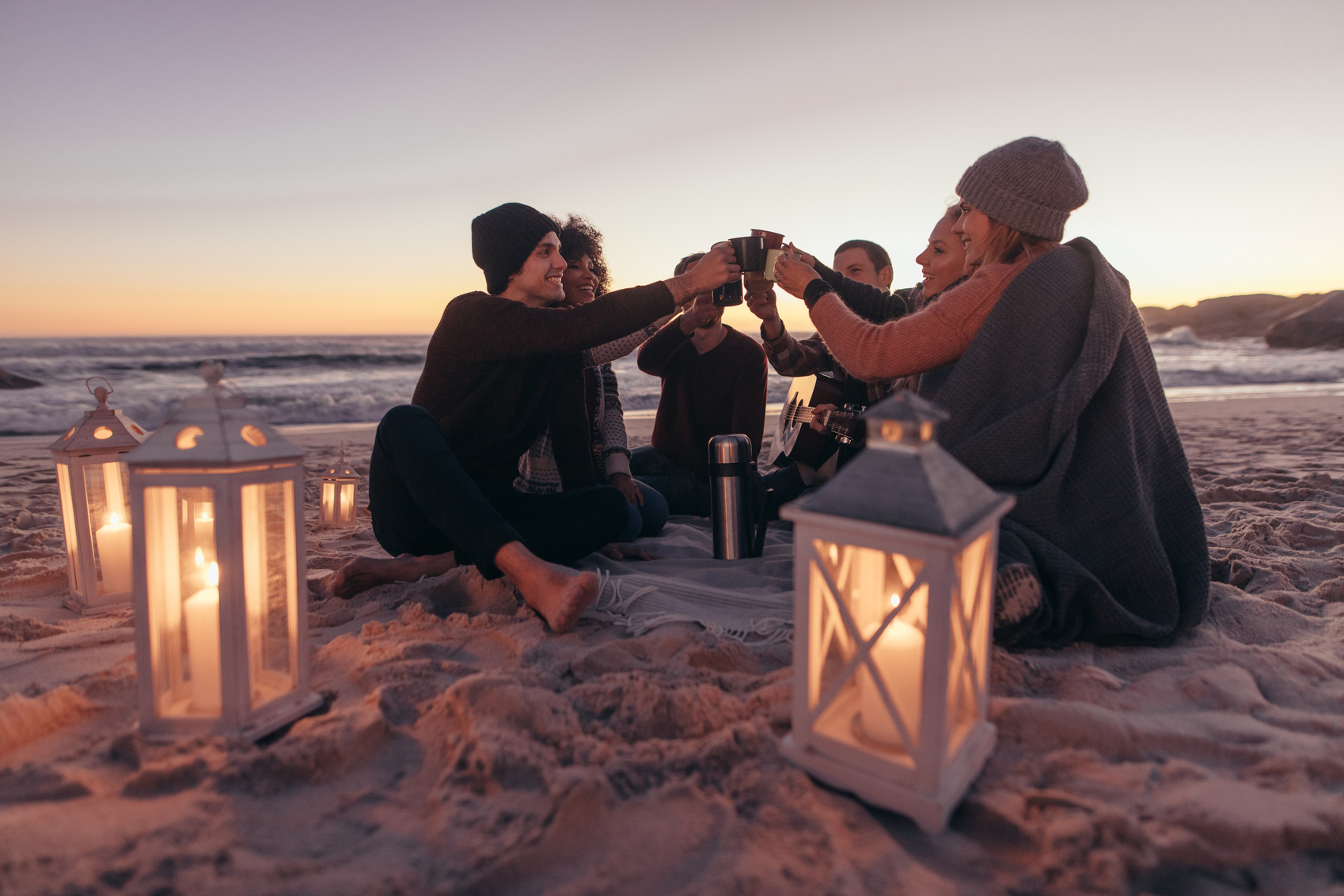 Friends Partying at the Beach with Coffee